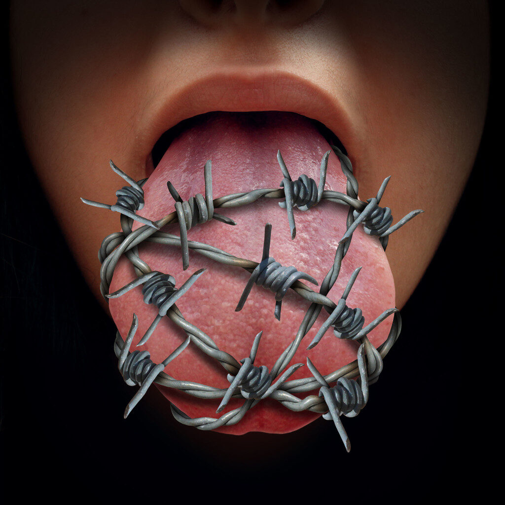 46713972 - freedom of speech crisis concept and censorship in expression of ideas symbol as a human tongue wrapped in old barbed wire as a metaphor for political correctness pressure to restrain free talk or limit communication.